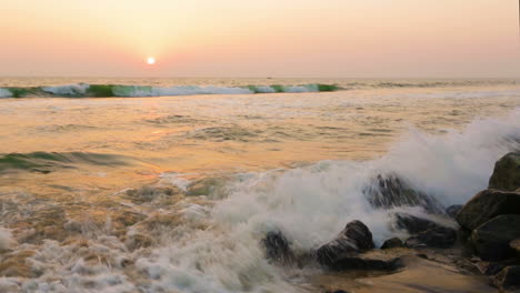 Waves-and-foam-on-rocky-beach