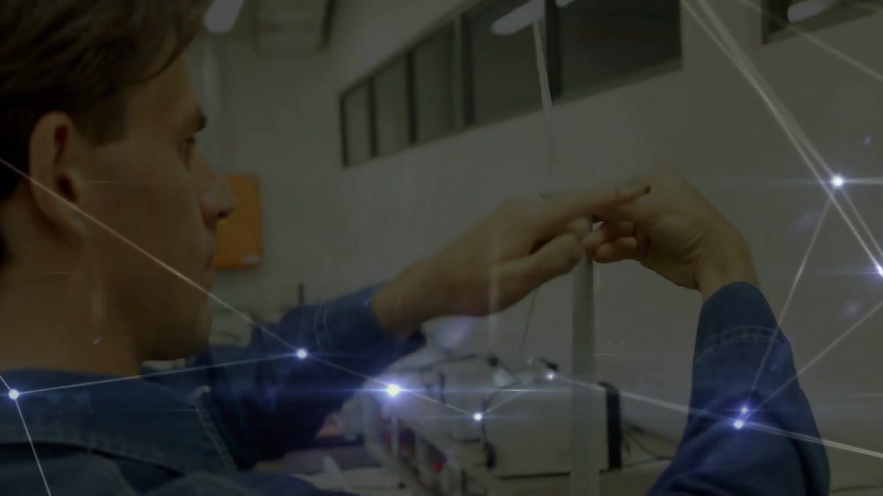 Measuring technician wearing dark denim shirt using caliper on metal rod at lab bench, overlay