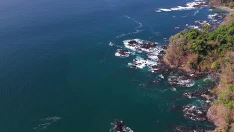 aerial tilting shot revealing the beautiful cebaco island shoreline in veraguas