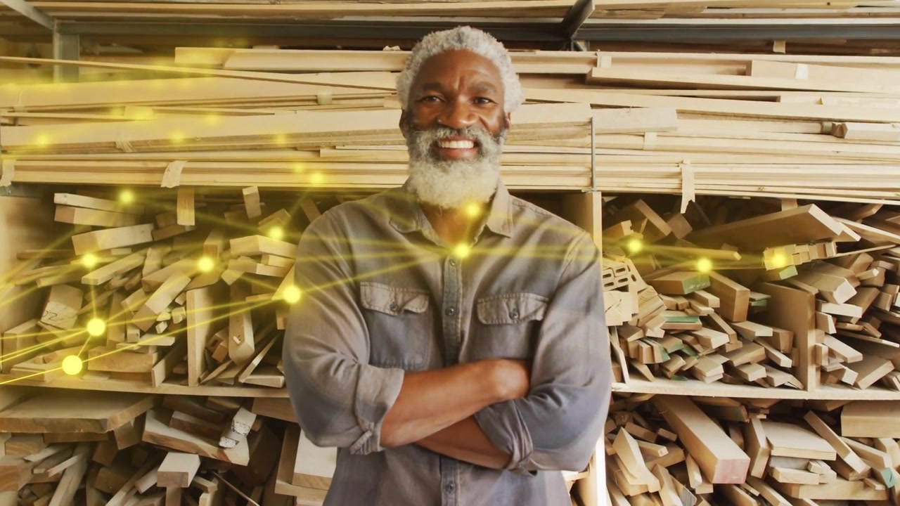 Senior carpenter facing camera yellow nodes and lines entering left sweeping to chest showing craft