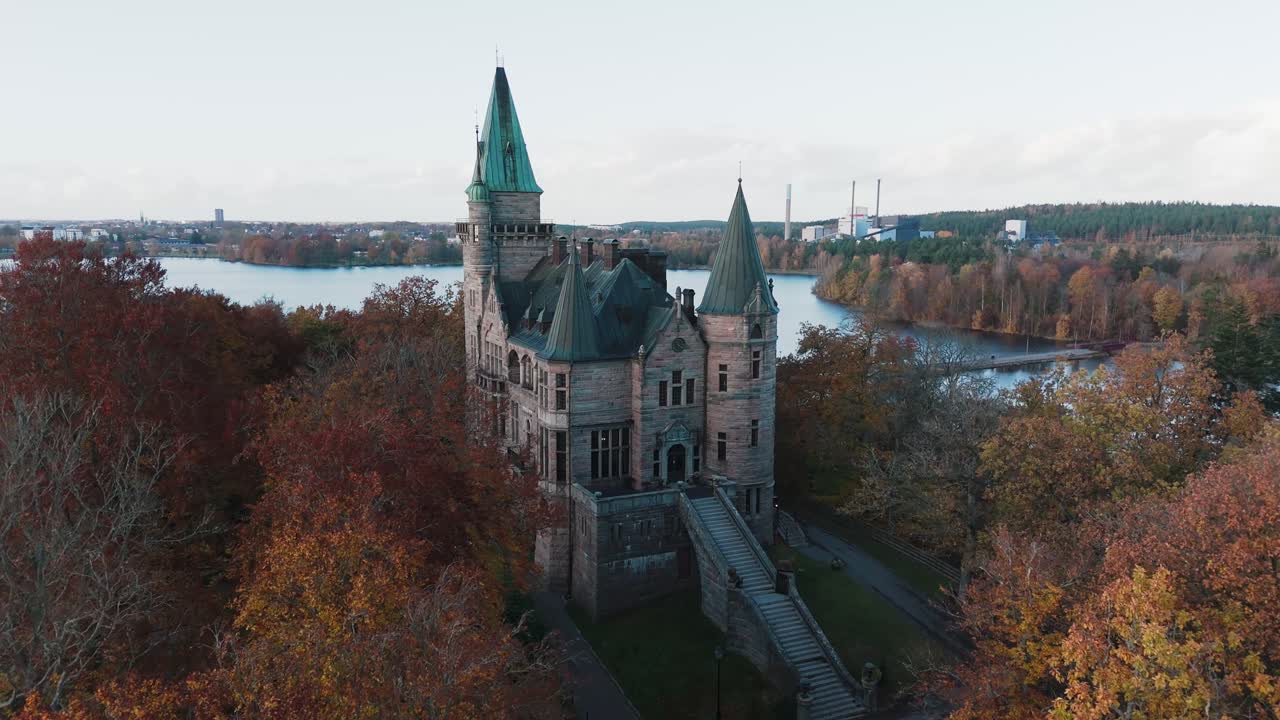 Tracking shot towards Teleborg Castle in Växjo, Sweden, Fall, Orange and Yellow Leafs
