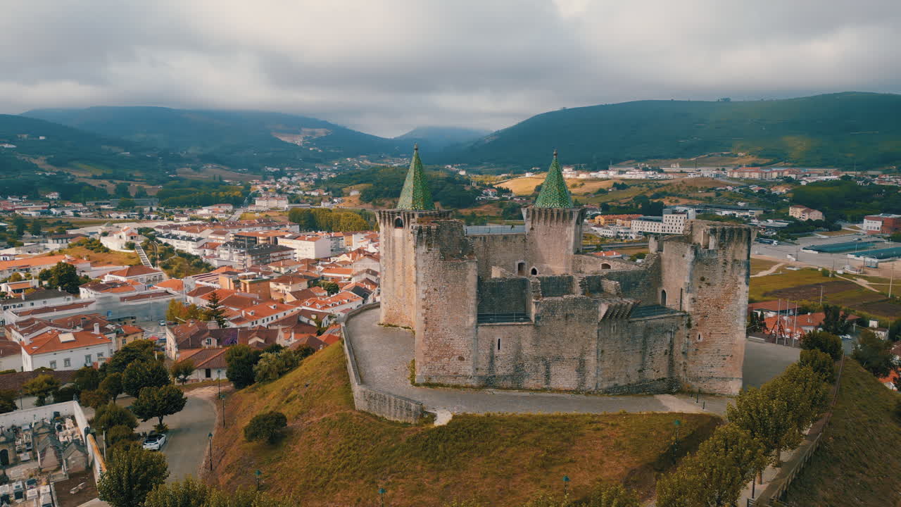 Aerial perspectives of the Castle of Porto de Mos, showcasing its historical architecture and surrounding landscape in Portugal