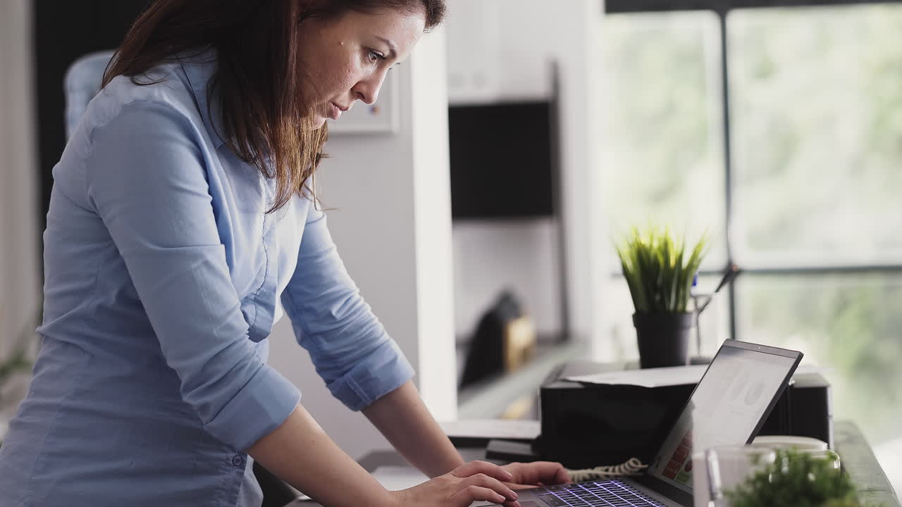 Businesswoman working on her laptop in the office