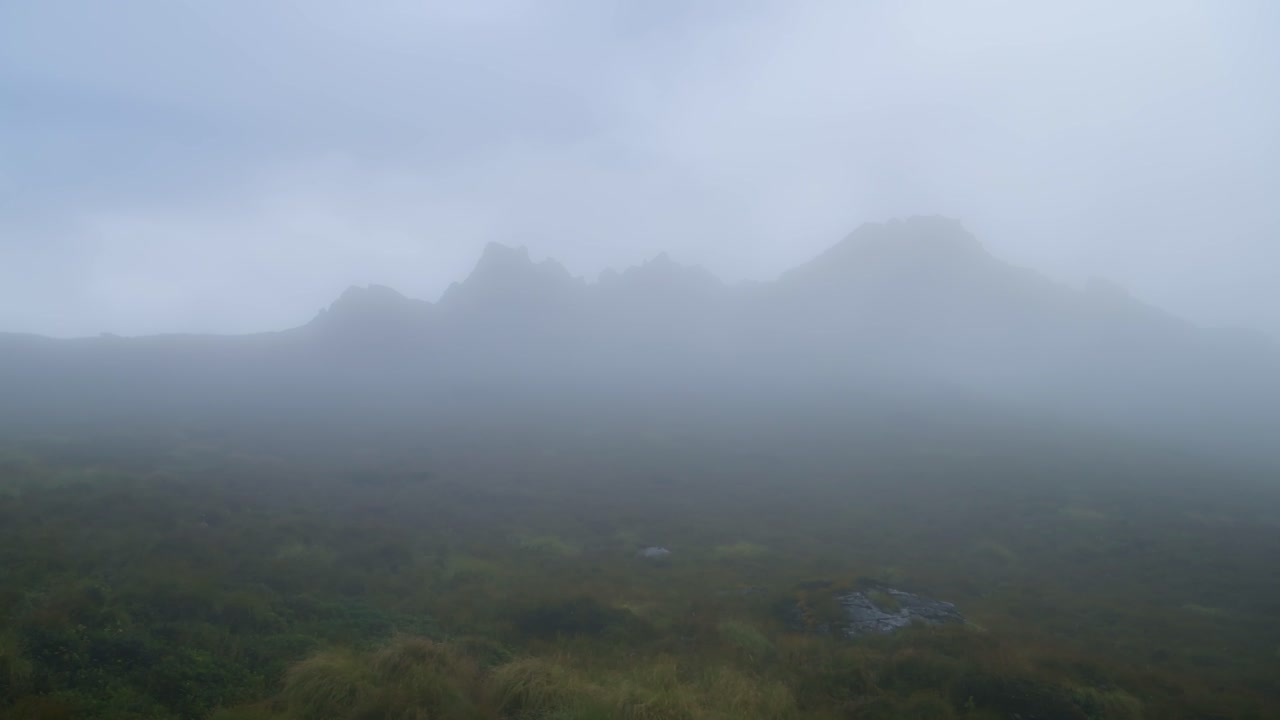 High Altitude Misty Mountain Terrain, Atmospheric Moody Mysterious Scenery with Mist and Barren Rugged Landscape Above the Treeline in the Himalayas in Nepal