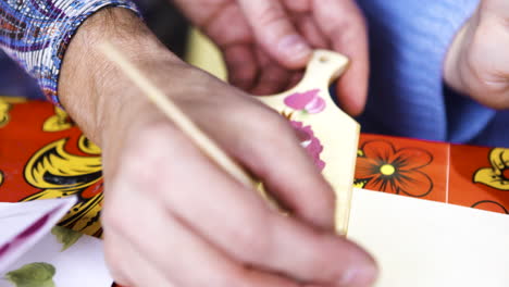 Hand Painting a Wooden Object in Khokhloma Style