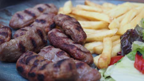 grilled kofta with french fries and salad
