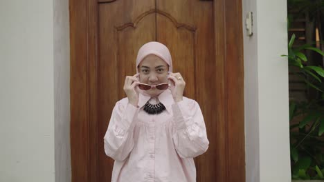 stylish muslim woman in pink shirt and hijab