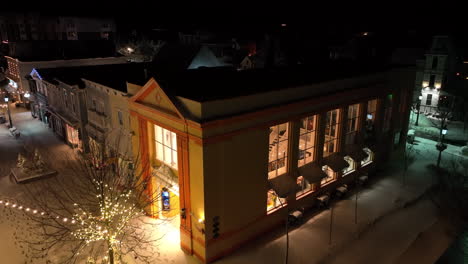 victorian building store shop at night decorated for christmas