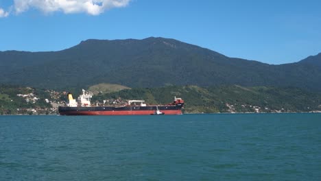 large bulk carrier ship on ilhabela island bay in sao paulo coastline, brazil