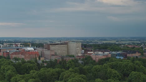 Flying-Over-The-Norra-kyrkogarden-Near-The-Skane-University-Hospital-In-Lund,-Sweden