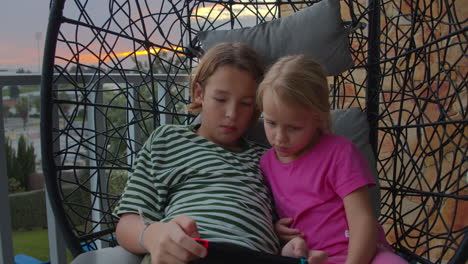 sunset gaming on coastal balcony