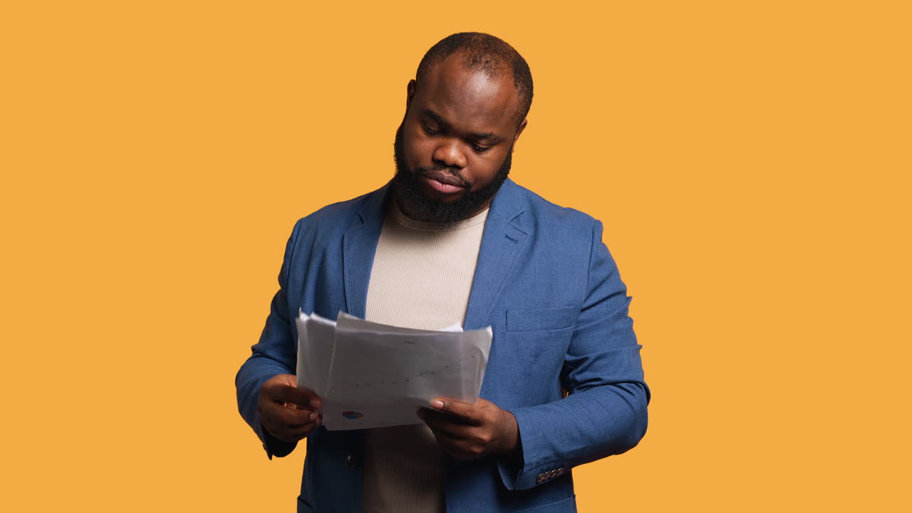 Accountant throwing files in air, feeling overworked, studio background