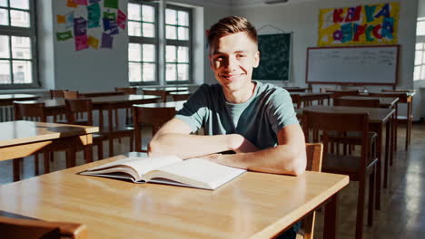 teenage boy reading in classroom