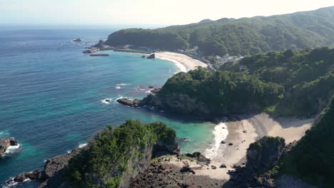 stunning cinematic drone flight over beach with cliffs on izu peninsula in japan