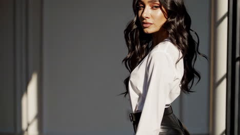 portrait of a beautiful woman with long dark wavy hair