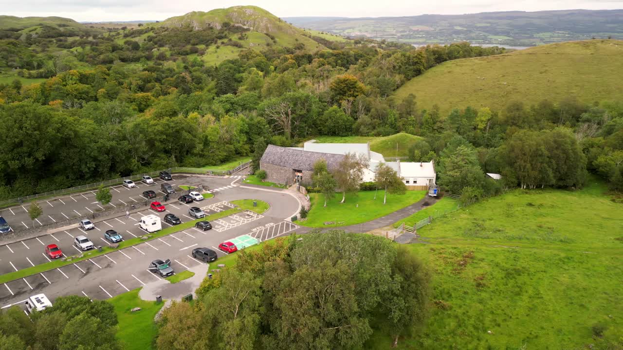 Anti-clockwise 4K 30FPS aerial of Marble Arch Caves in County Fermanagh, Northern Ireland on a bright sunny day. Produced with Rec709 color