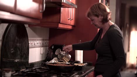 senior woman cooking in kitchen