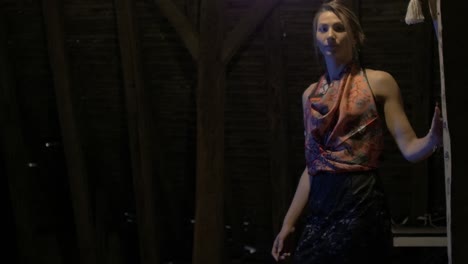 static shot of rustic attic, woman walking into view