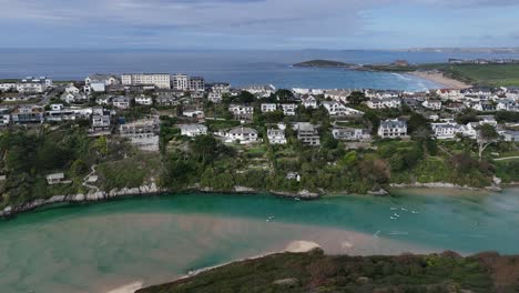 Pull-back-drone-aerial-reverse-reveal-Crantock-Village-Cornwall-UK-drone,aerial