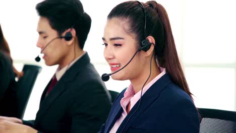 business people wearing headset working in office