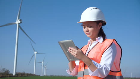 female engineer working at a wind farm