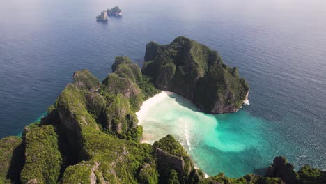 Aerial 4k drone video of Phi Phi Leh with Maya Bay and Pileh Lagoon, Krabi province, Thailand. Aerial top view of amazing tropical island with turquoise water and white beach, famous destination