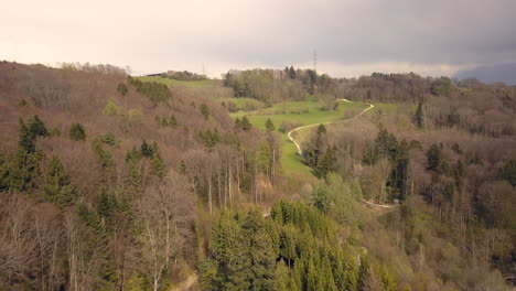 Aerial-forward-over-Arboretum-of-Aubonne-landscape,-Switzerland
