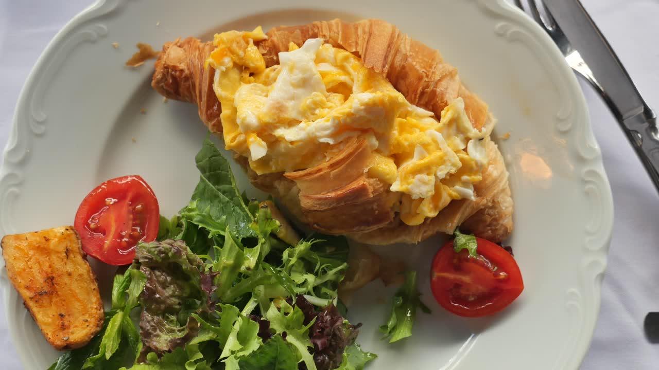 Croissant with Scrambled Eggs and Salad