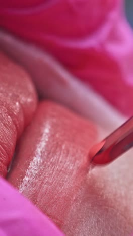 cosmetologist making permanent makeup