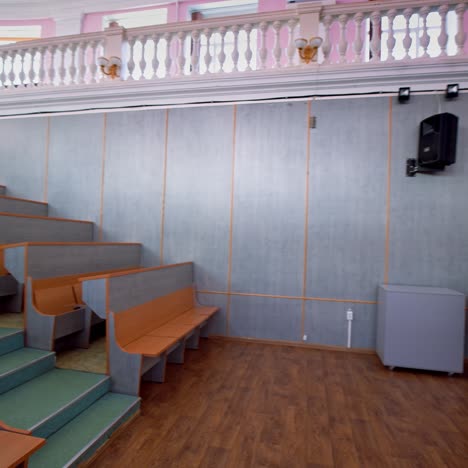 wooden benches inside auditorium