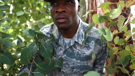 Military-soldier-looking-around-in-park