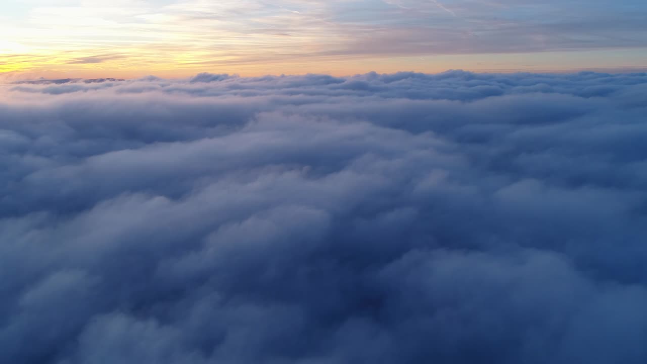 Drone flight above moving cloudscape