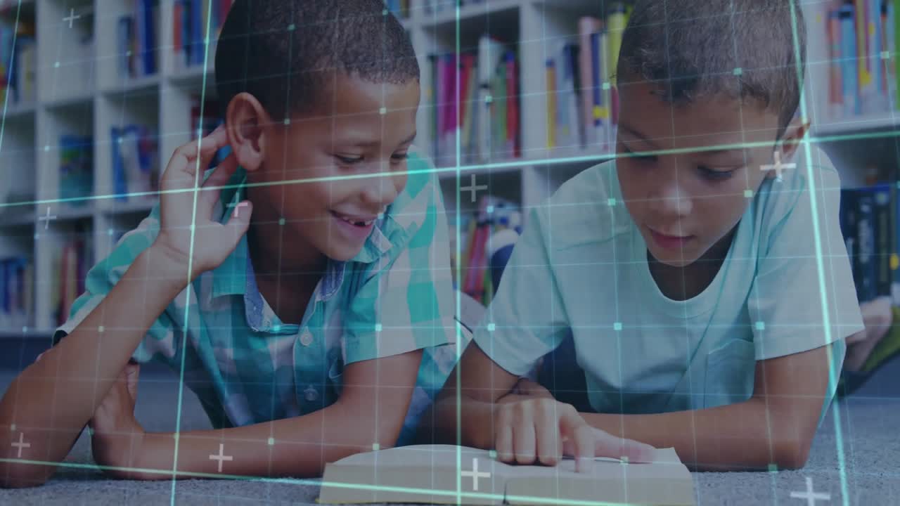 Digital grid overlay fading in revealing two boys collaborating on reading textbook in library