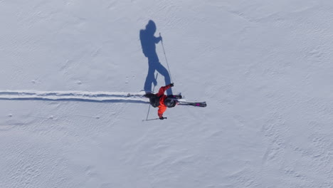 A professional skier hikes up a steep ridge in Verbier, then drops into an epic freeride descent. Pure adventure skiing in deep snow, dramatic terrain, and breathtaking alpine scenery.