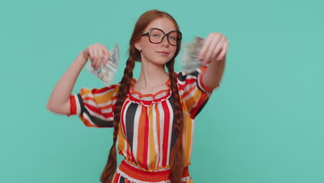 redhead girl holding cash money dollar celebrate dance, success business career, lottery game winner