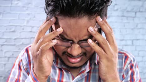 man experiencing headache