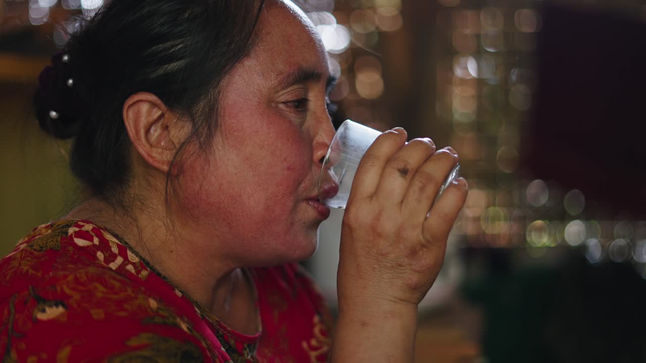 Woman drinking water from glass