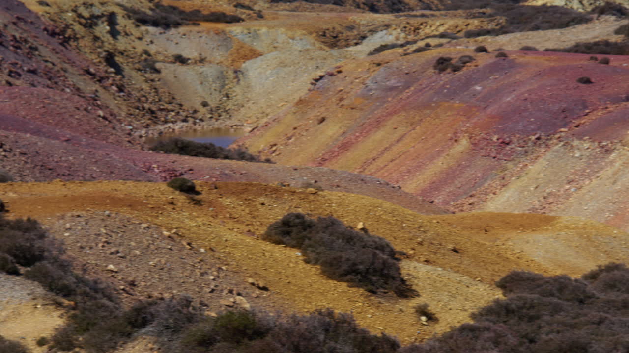 Wide panning shot of the north side of the Great opencast mine at mynydd parys mountain copper mine
