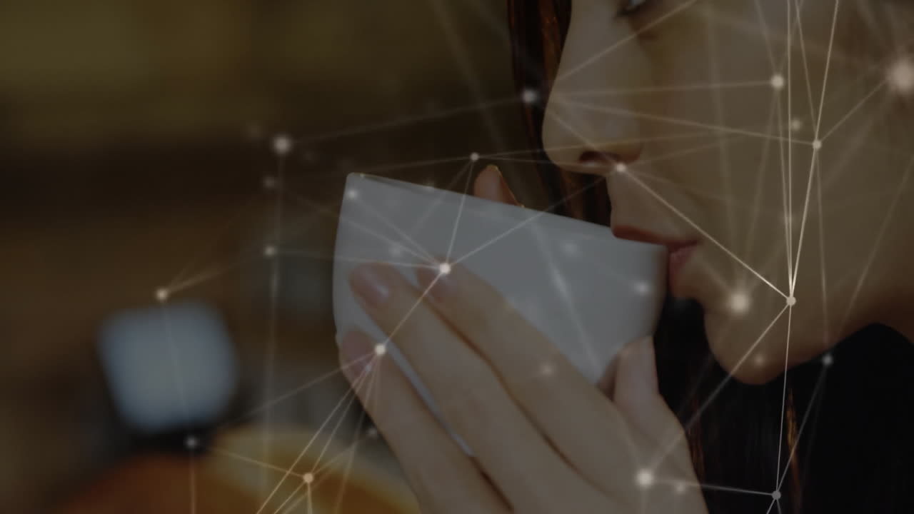 woman raising ceramic cup indoors, showing network lines with glowing nodes in tech scene