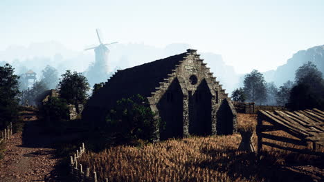 paisaje de un pueblo medieval con molino de viento