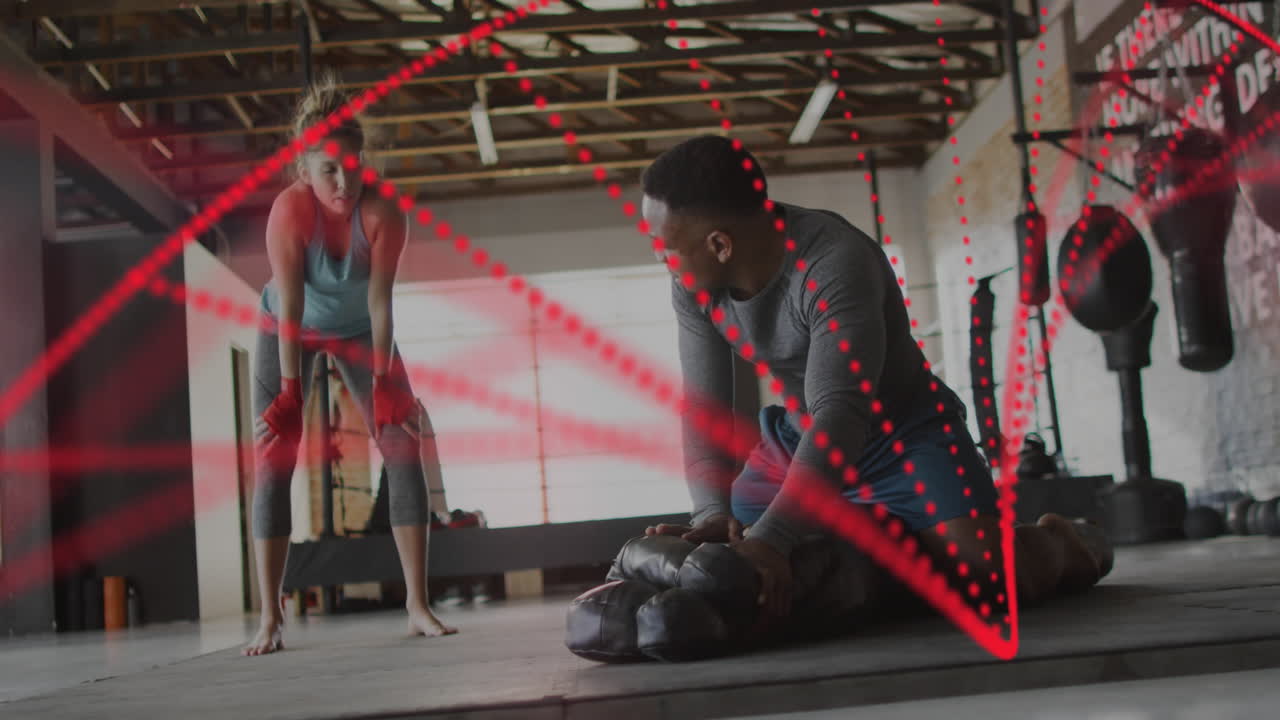 박싱 체육관에서 운동하는 다양한 남성과 여성에 대한 dna 줄무의 애니메이션과 데이터 처리