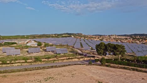 aerial drone shot flying over solar panel field, power energy generation