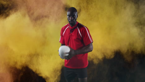 jugador de rugby profesional sosteniendo una pelota 4k