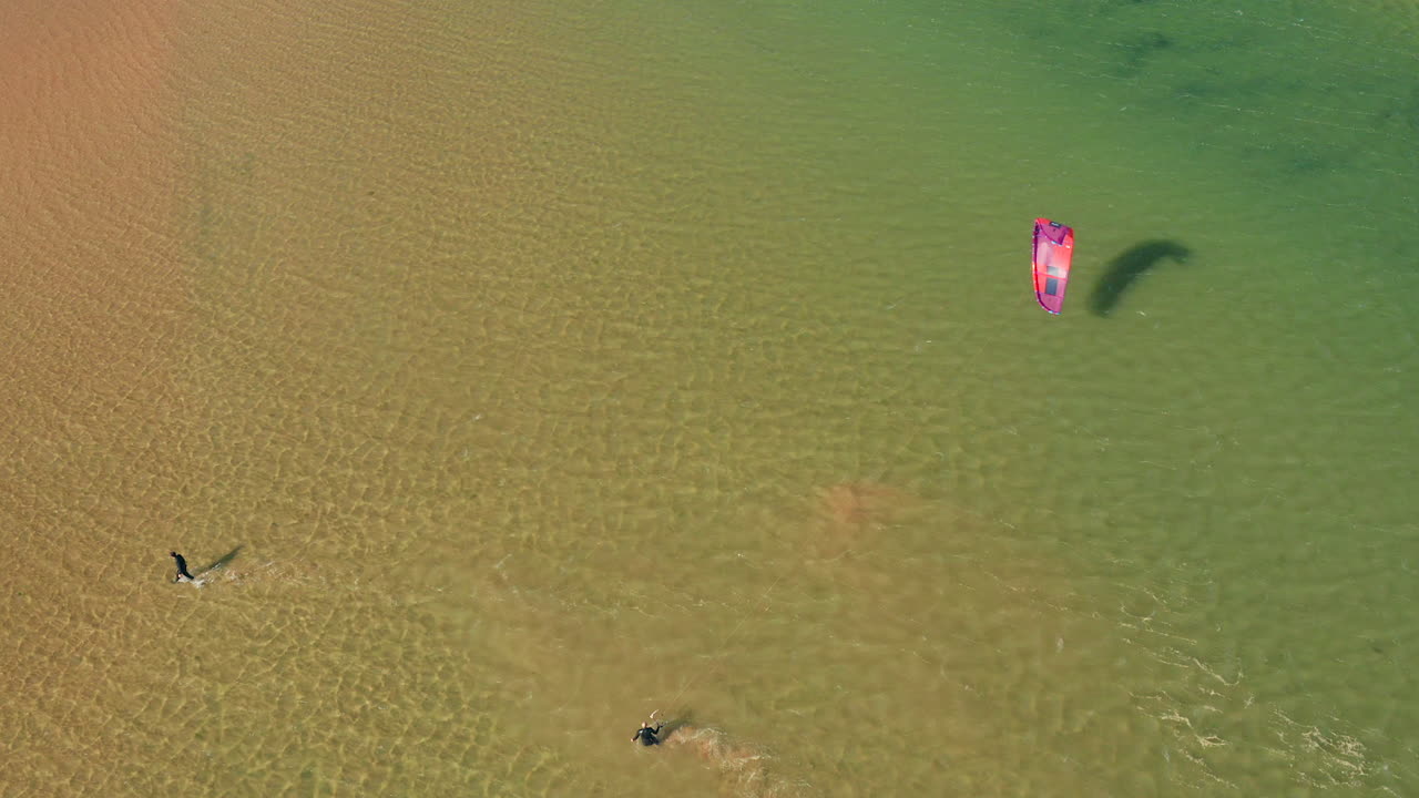 Aerial: Kitesurfing in the lagoon of Alvor