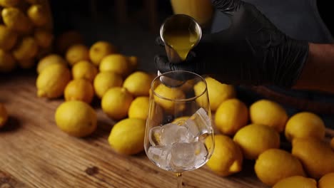 bartender making a lemon cocktail