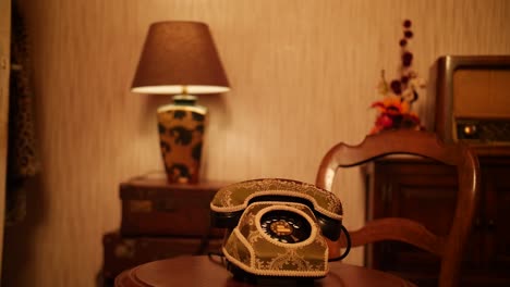 Elegant rotary phone and antique radio in a warm, nostalgic vintage-style room