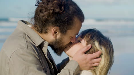 closeup shot of young caucasian couple kissing