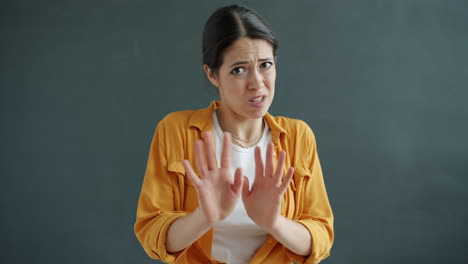 Woman expressing disgust and rejection