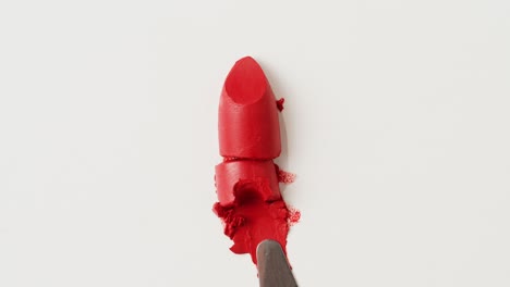 Broken Red Lipstick on Palette Knife