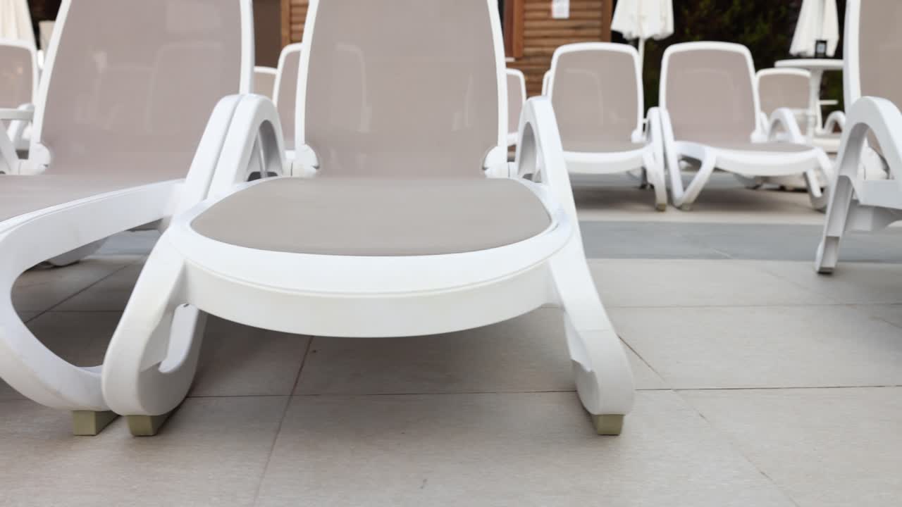 Rows of Sun Loungers by the Pool